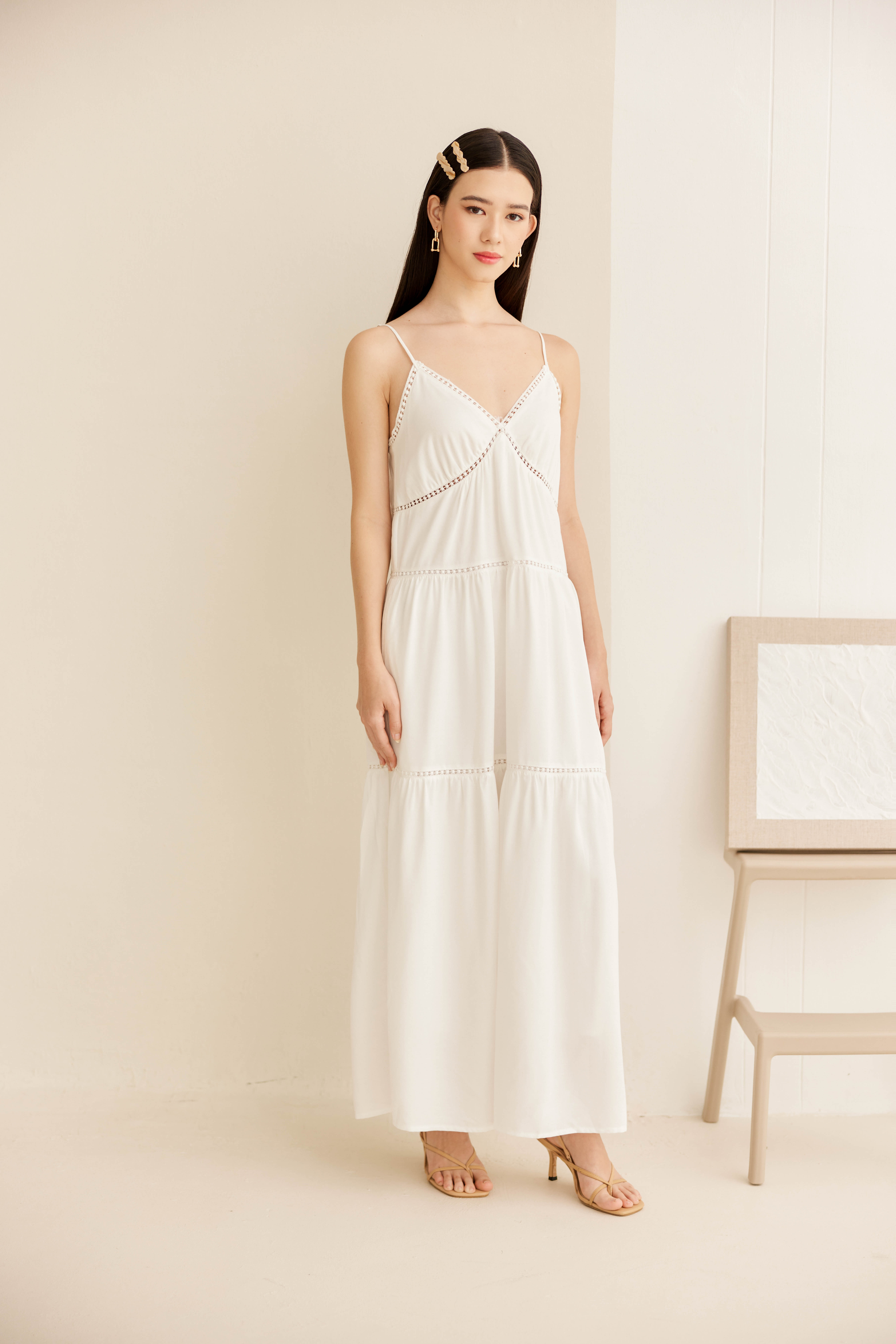  woman wearing a cozy white dress